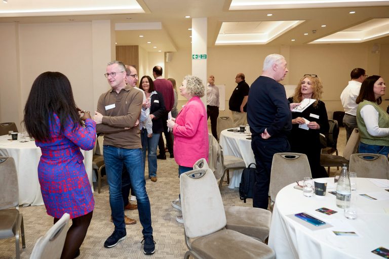 An event taking place with people talking in the Wolfson Hall space at The Central